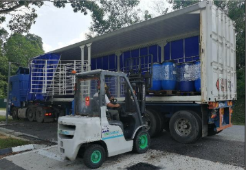 Loading scheduled waste (chemical waste) to prescribed premises in Malaysia.