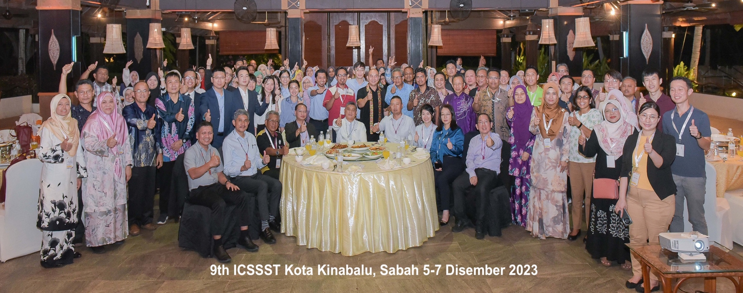 A group of people sitting around a table
Description automatically generated