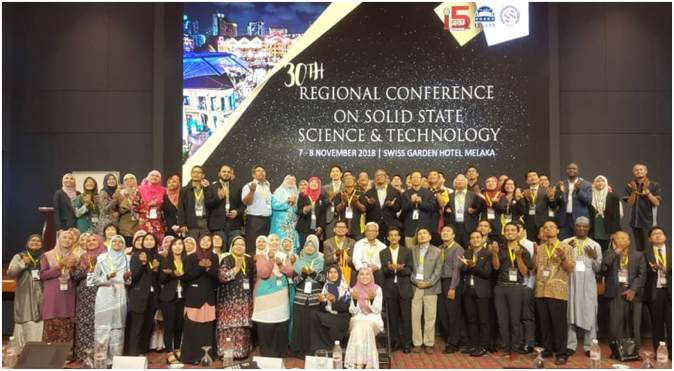 A group of people posing for a photo
Description automatically generated with medium confidence