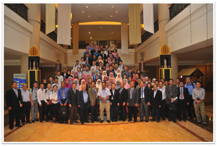 A group of people posing for a photo
Description automatically generated