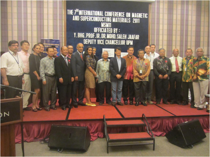 A group of people standing on a stage
Description automatically generated with medium confidence